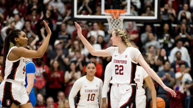 Feb 20, 2023; Stanford, California, USA; Stanford Cardinal forward Cameron Brink (22) and forward Kiki Iriafen (44) celebrate their 71-66 victory over UCLA Bruins at Maples Pavilion. Mandatory Credit: John Hefti-USA TODAY Sports